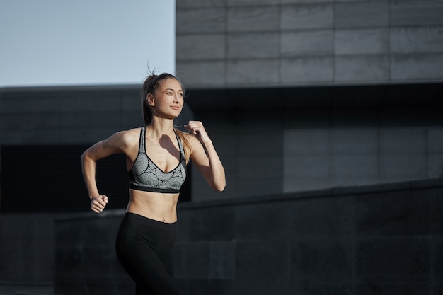 Woman running urban city street