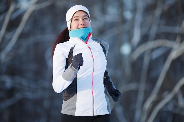 Woman running in winter park