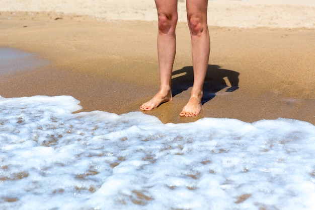 Woman's feet on the beach