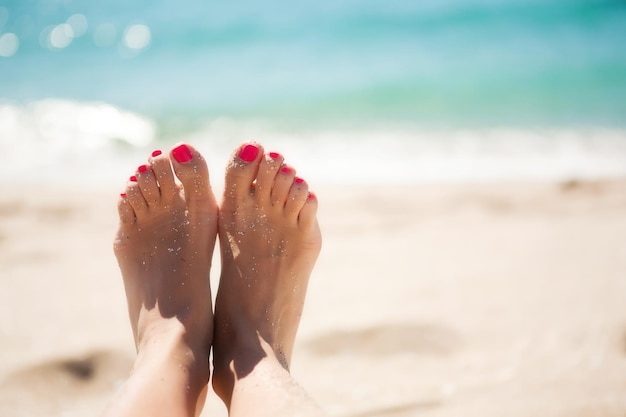 woman's feet at the seaside