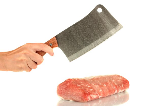 Photo woman's hand cuts the pork on white background closeup