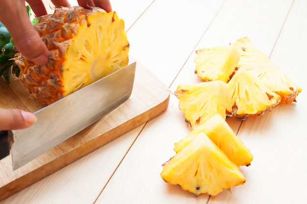 Woman's hand cutting pineapple, Nutrition, Healthy food