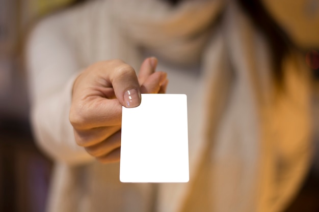 Woman's hand holding blank card