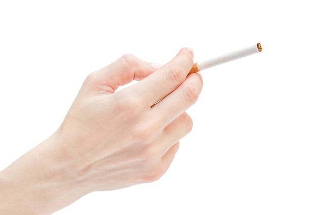 Woman's hand holding cigarette Isolated on white