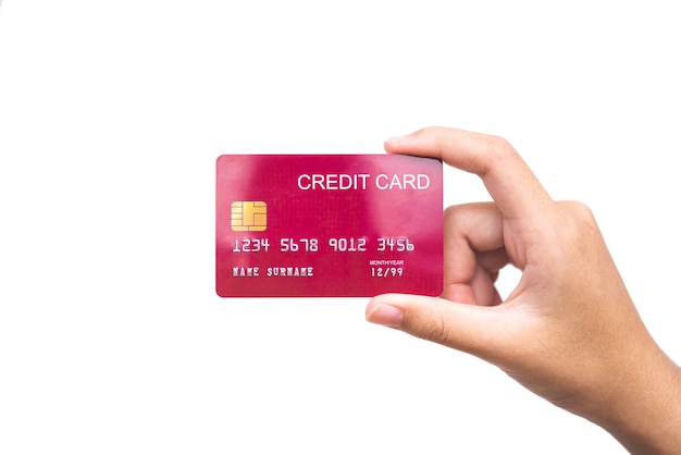 Woman's hand holding a credit card on a white background. Online payment for online shopping