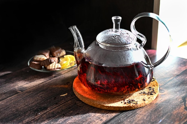 A woman's hand pouring tea into a mug steamed tea morning tea
home comfort