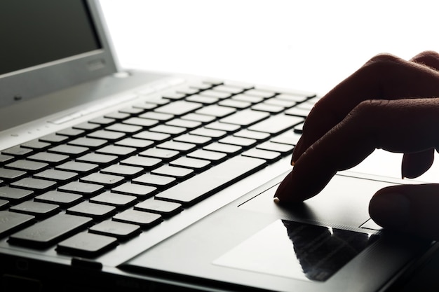 Woman's Hand Using Laptop