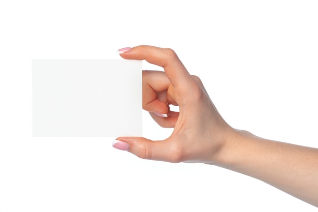 Woman's hand with blank white business card isolated on white