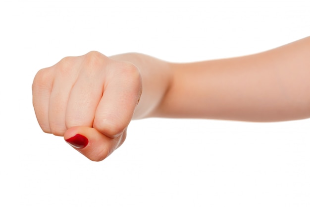 Foto la mano della donna con il gesto del pugno isolato su bianco