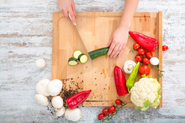 A woman's hand with vegetables