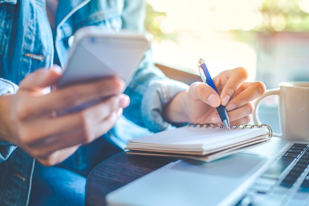 Woman's hand working in office.