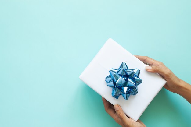 Woman's hands holding beautiful gift box, Flat lay. Father's Day