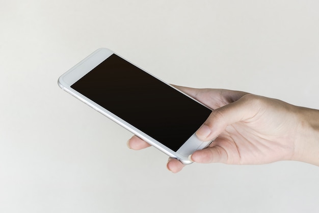 woman's hands holding smart phone