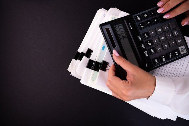 Woman's hands using a calculator