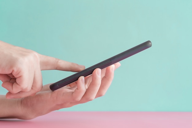 Woman's hands using a smartphone