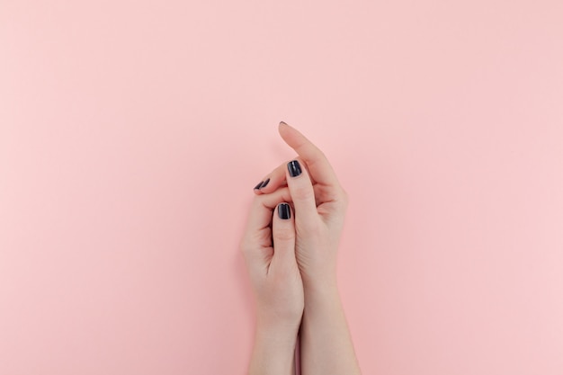 Woman's hands with black manicure