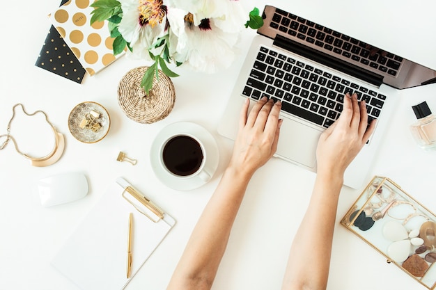 Woman's hands working on laptop