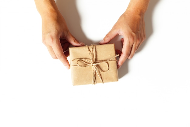 Woman's hands wrapping a gift