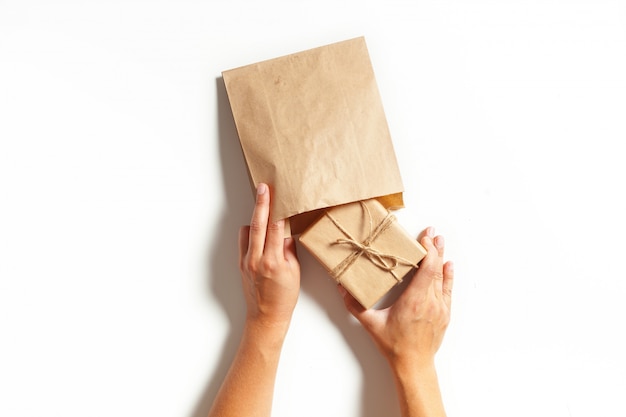 Woman's hands wrapping a gift