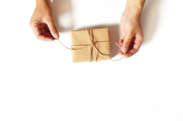 Woman's hands wrapping a gift