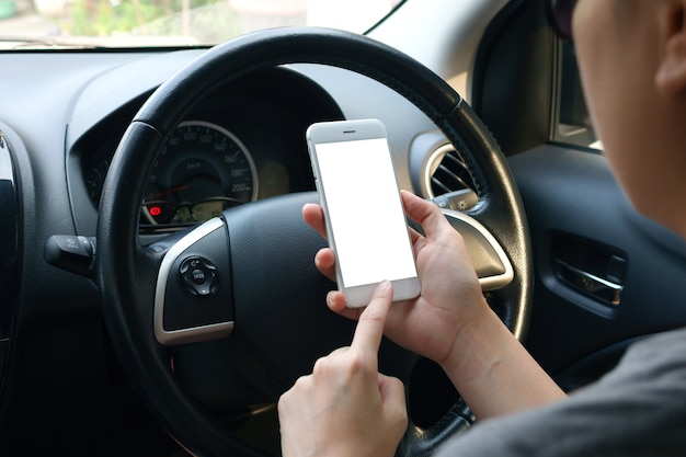 woman's holding empty screen of smart-phone inside a car