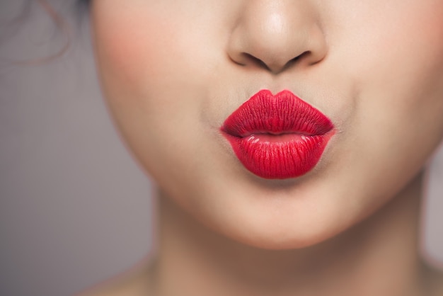 Woman's lips with red lipstick