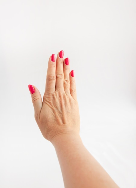 Woman's wellgroomed hand isolated on white background