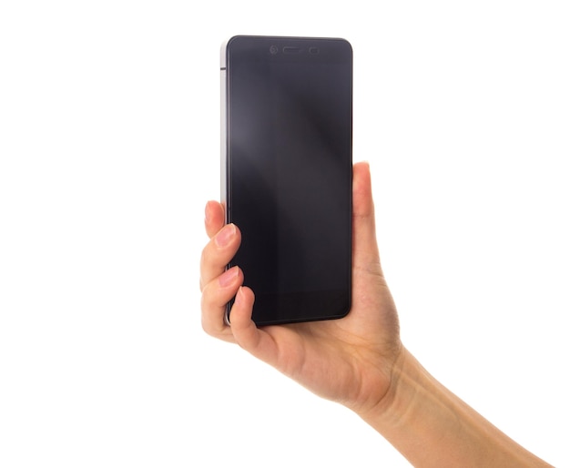 Woman's white hand holding a black smartphone and on white background in studio