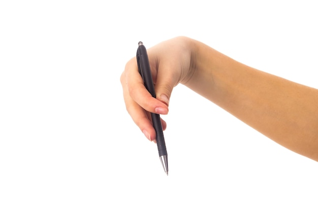 Woman's young hand holding a black pen on white background in studio