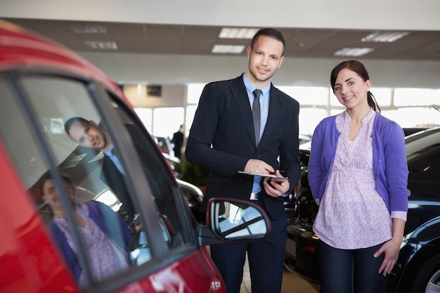 Woman and a salesman standing side by side