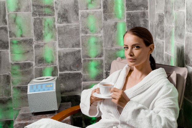 Woman in salt room relax. Inhalation therapy in salt room in spa.
