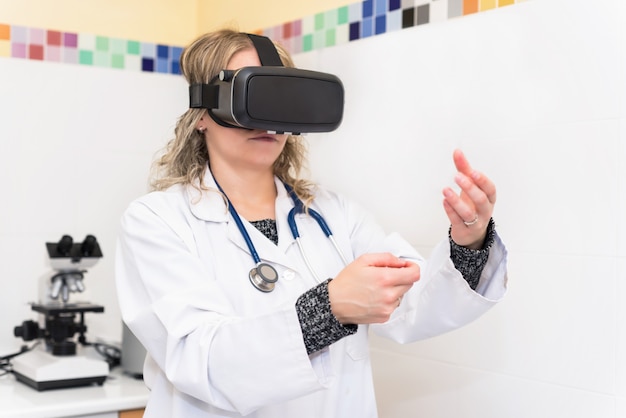Woman scientist in laboratory with virtual reality glasses