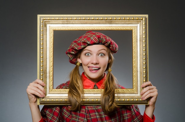 Woman in scottish clothing in art concept