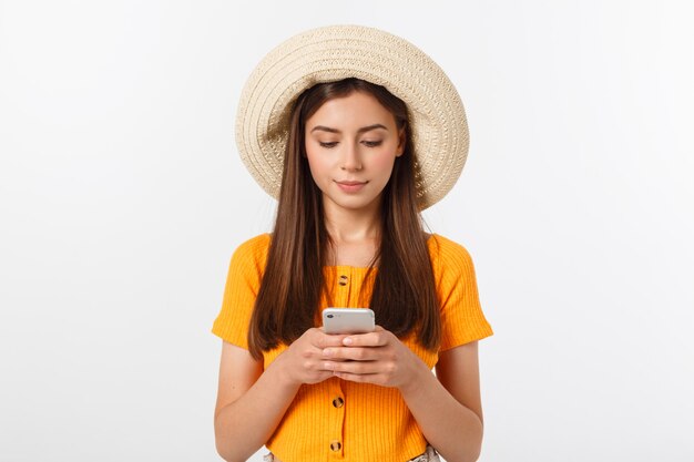 Woman sending a sms on cell phone