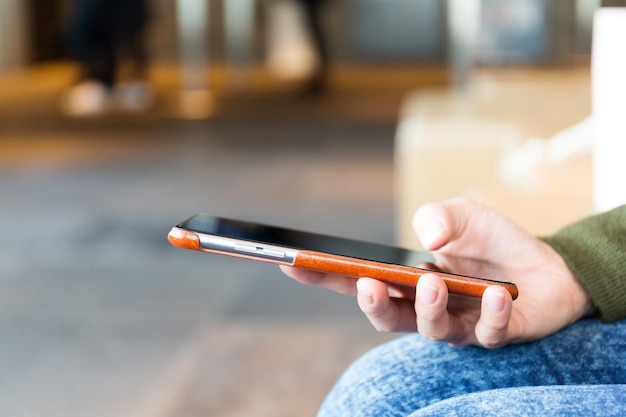 Woman sending text message on smart phone