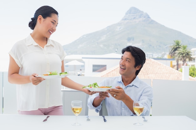 Woman serving a meal for her boyfriend