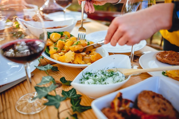 Woman serving roasted potato