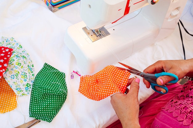 Woman sewing face masks at her home