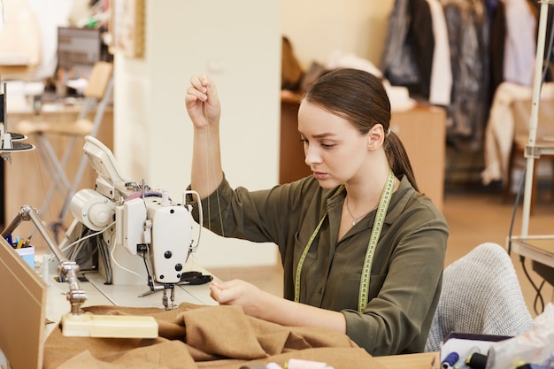 Woman sewing at the table