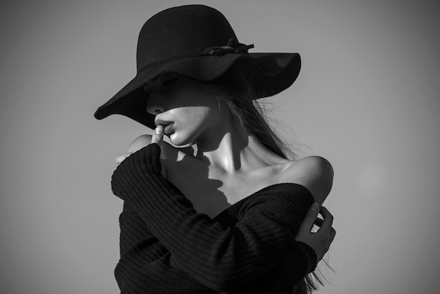 Woman in shadow hat