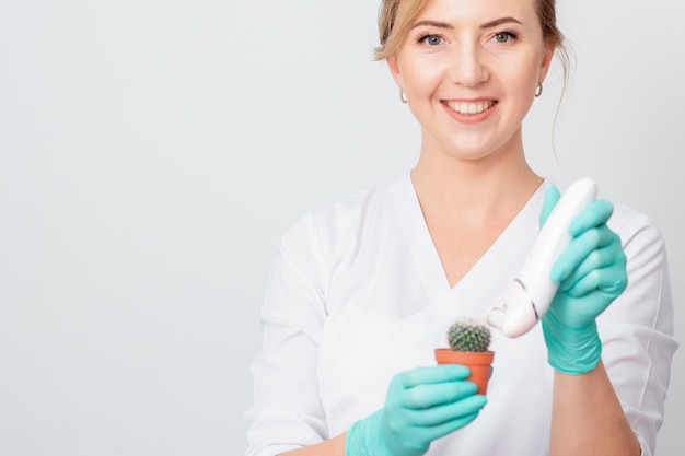 Woman shaves green cactus.