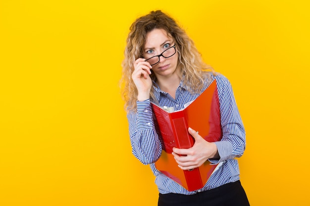 Woman in shirt with big folder