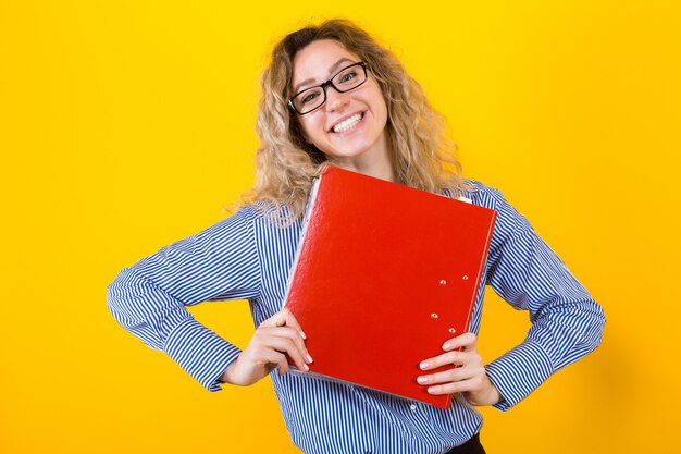 Woman in shirt with big folder