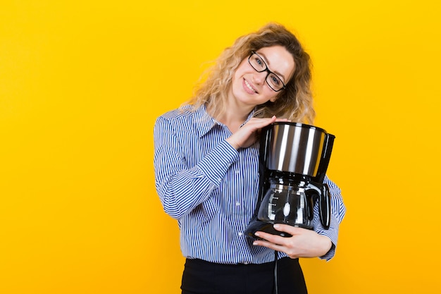 Woman in shirt with coffee machine