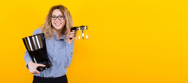 Woman in shirt with coffee machine