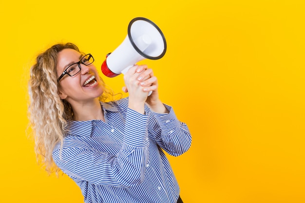 Woman in shirt with loudspeaker