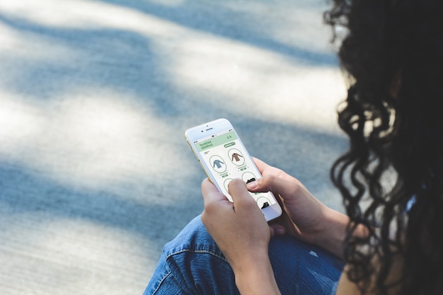 Woman shopping for clothes on smartphone