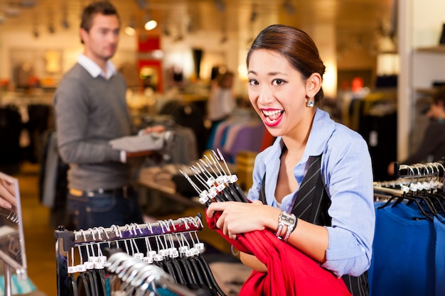 Woman in a shopping mall with clothes