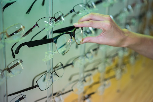 Woman shopping for new glasses