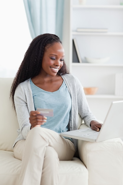 Woman shopping online on couch